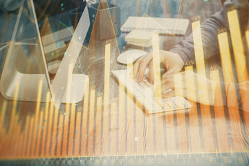 Fototapeta na wymiar Double exposure of financial graph with man works in office on background. Concept of analysis.