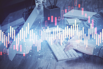 Double exposure of financial graph with man works in office on background. Concept of analysis.