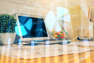 Fototapeta na wymiar Forex market graph hologram and personal computer on background. Double exposure. Concept of investment.