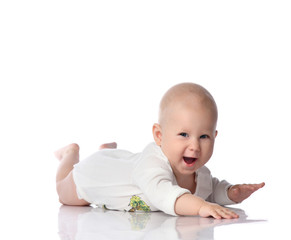 Infant child baby boy toddler lying in white shirt happy smiling isolated on a white 