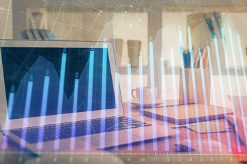 Forex market chart hologram and personal computer background. Double exposure. Concept of investment.