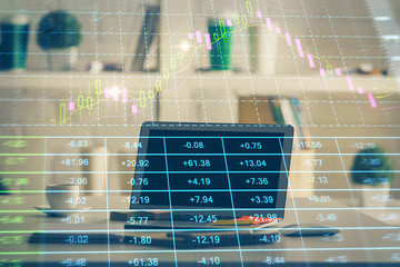 Forex market graph hologram and personal computer on background. Multi exposure. Concept of...