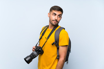 Young photographer man laughing