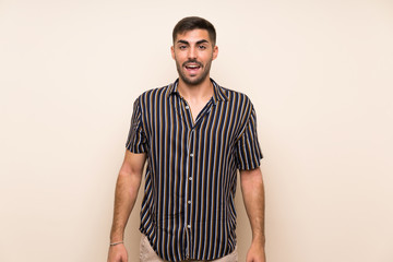 Handsome man with beard over isolated background with surprise facial expression