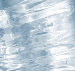 Ice background. Pattern of transparent shiny ice. Natural bright background