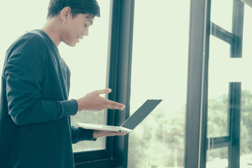 Fototapeta premium male freelancer working with computer. startup man analyzing data. student studying doing assignment