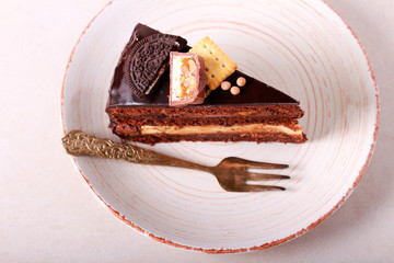 Rich chocolate and caramel cake slice