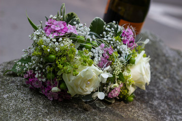 Wedding bouquet and bottle of wine for wedding