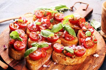fresh tomato bruschetta. italian food appetizer with basil on table
