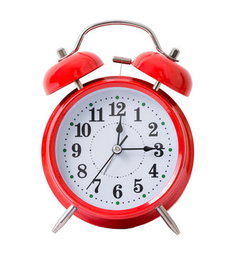 Red alarm clock, isolated on the white background