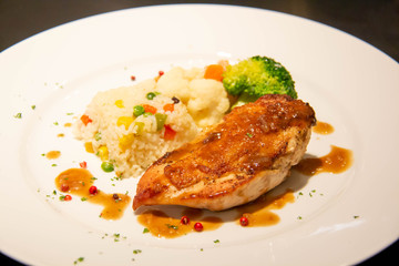 A chicken steak on plate