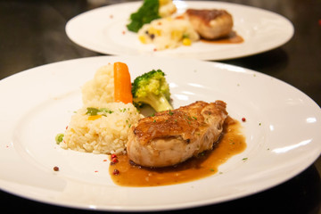 A chicken steak on plate