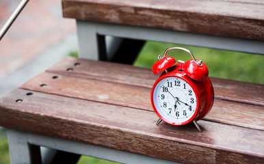 Alarm clock in the morning outdoors, on the steps, Workplace