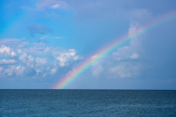 Rainbow over the calm Black Sea in Sochi in the morning