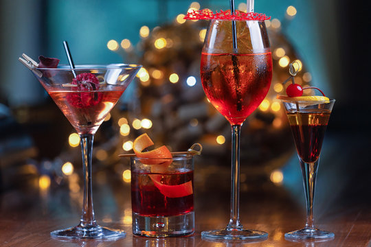 Beautiful cocktails on a background of a garland