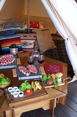 Meat dinner in outdoor tent