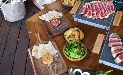 Wooden table and meat dish
