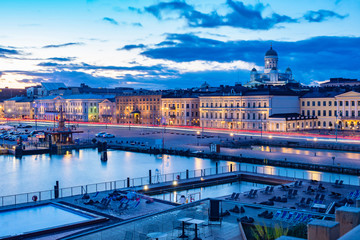 Helsinki. Finland. Evening panorama of the capital of Finland. Outdoor pool in the southern harbour of Helsinki. Allas. Outdoor Seating area. Market square. Suurkirkko. Cathedral Of St. Nicholas
