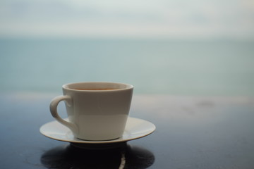 cup of coffee on wooden table