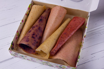 handmade homemade pastila in a box on a light background. A set of different fruits, fruit candy with apples, fruit candy with strawberries, fruit candy with currants