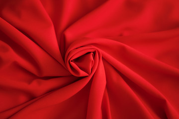 Red batiste made of cotton. sample of red soft fabric with pleats. Top view - obrazy, fototapety, plakaty