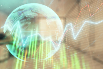 Stock and bond market graph and world map with trading desk bank office interior on background. Multi exposure. Concept of international finance