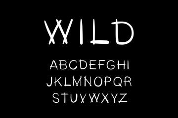 Naklejka premium Wild hand drawn vector type lettering font black white native style