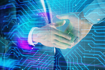 Multi exposure of bitcoin sign on abstract background with two men handshake. Concept of...