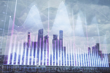 Double exposure of financial graph on downtown veiw background. Concept of stock market research and analysis