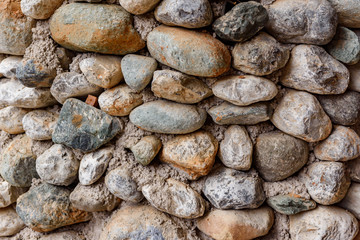 Fototapeta na wymiar Rounded stones background and texture