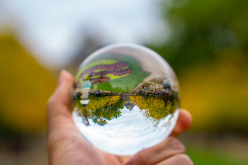 crystal ball, also known as an orbuculum or crystal sphere, is a crystal or glass ball and common fortune-telling object. It is generally associated with the performance of clairvoyance and scrying.