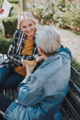 Lady talking to a friend in a park