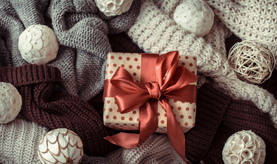 Christmas background with cozy sweaters and festive decor .