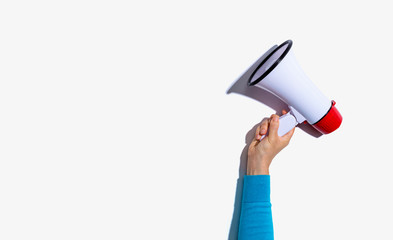 Person holding a megaphone with hard shadow