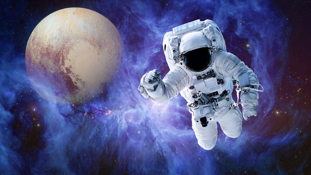 Alone Astronaut and fiction planet in outer space near the Sword of Orion and nystical fiction planet. Science fiction wallpaper. Elements of this image were furnished by NASA - Powered by Adobe