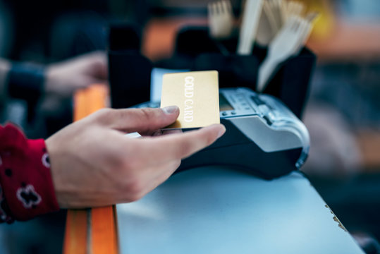 Male using payment terminal at counter stock photo