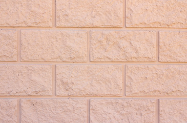 Brick wall background texture. Exterior wall decoration and design. beige