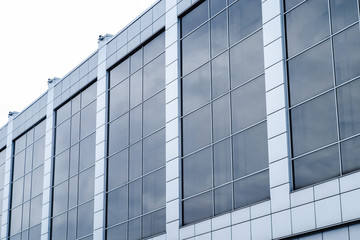 close-up of a modern glass building with square blue glass