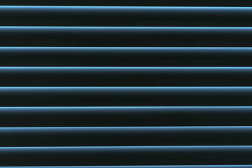 closed shutters close-up, light from street breaks into dark bedroom or office, background texture striped