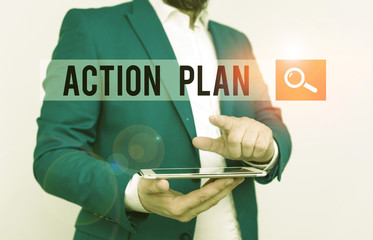 Text sign showing Action Plan. Business photo text detailed plan outlining actions needed to reach goals or vision Businessman with pointing finger in front of him