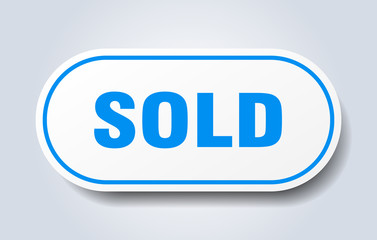 sold sign. sold rounded blue sticker. sold