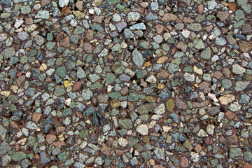 a piece of asphalt close up consisting of colored stones