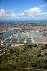 Aerial view of colorful salt evaporation ponds near Tema, Greater Accra, Ghana