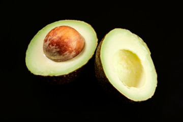 avocado cut on a black background