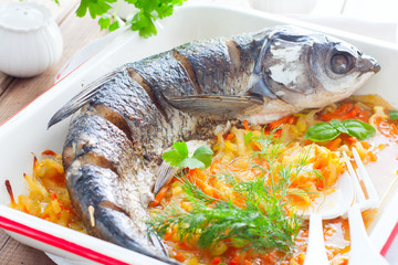 Baked whole white cupid with enameled vegetables, horizontal