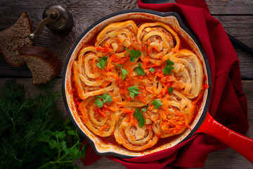 Homemade dish of dough and minced meat loaders, top view, selective focus