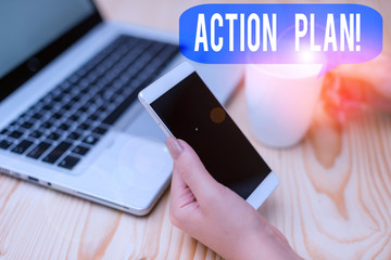 Text sign showing Action Plan. Business photo showcasing proposed strategy or course of actions for certain time woman laptop computer smartphone mug office supplies technological devices