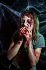 portrait of horrible zombie woman with wounds. Horror. Halloween make-up and costume