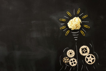 Education concept image. Creative idea and innovation. Crumpled paper as light bulb metaphor over...