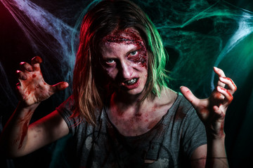 Scary undead zombie. Halloween make-up and costume